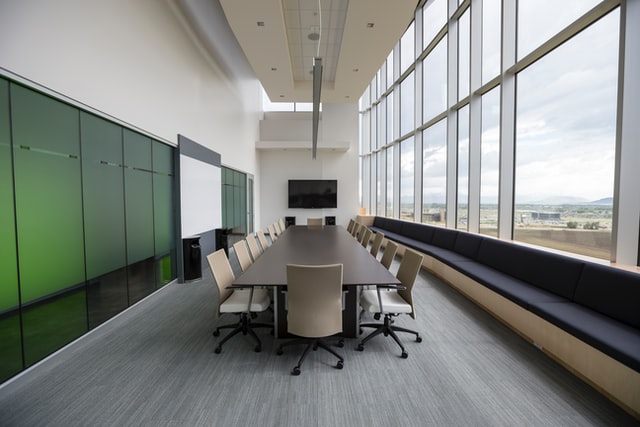 A business meeting room that is green