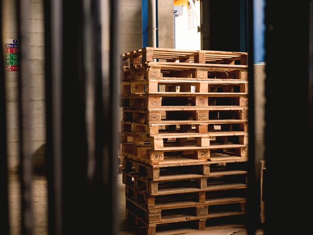 A pile of pallets stacked on top of each other.