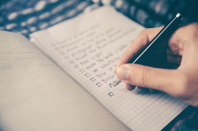 A person taking notes during a meeting.