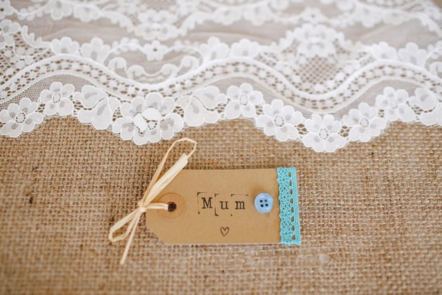 A printed tag label saying "mum"