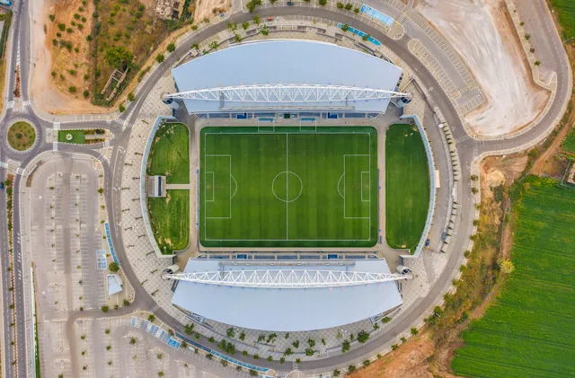 A shot taken by a drone over a football field. 
