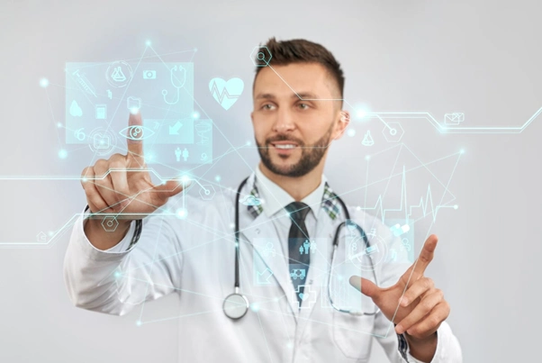 A male doctor wearing a white coat and stethoscope interacts with futuristic virtual interface holograms, representing the integration of technology in the future of healthcare advancements.